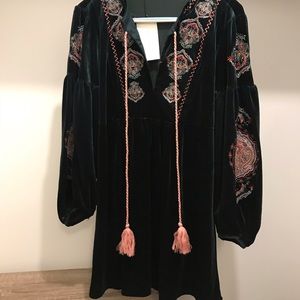 Dark green velvet dress with embroidery details